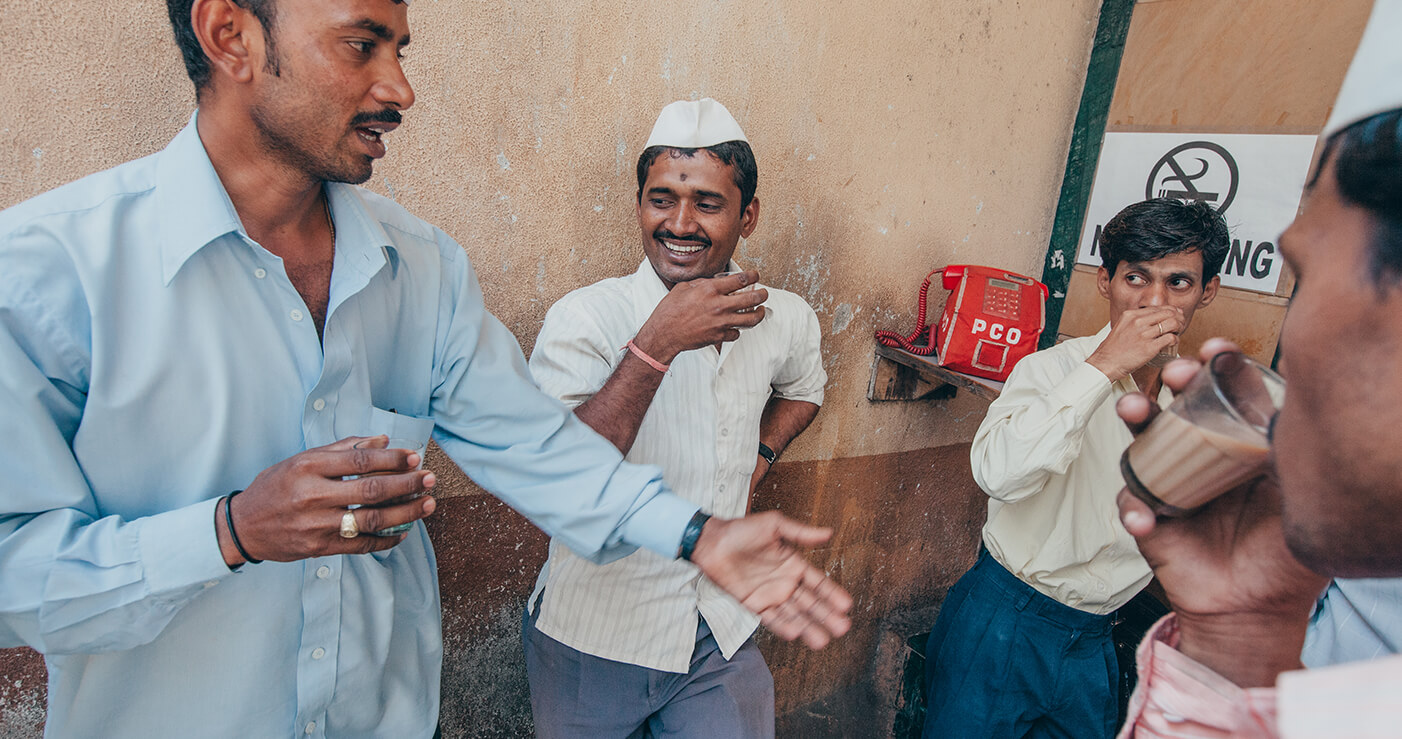 India Bakery_1402x739 A group of men talking