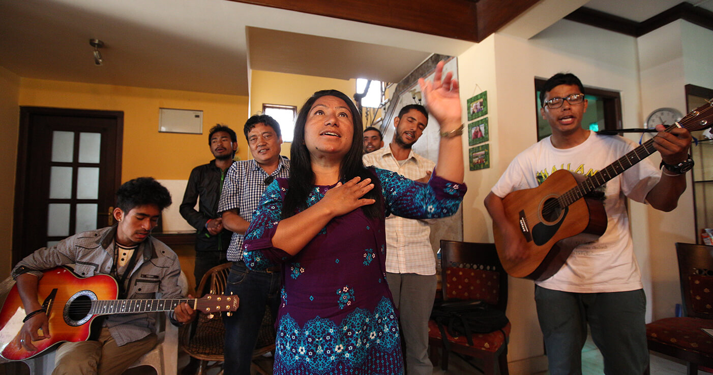 Nepal English_1402x739 A group is worshiping